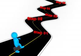 3d man following roadmap for success stock photo