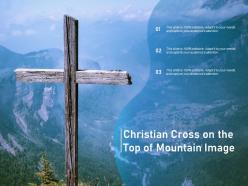 Christian cross on the top of mountain image