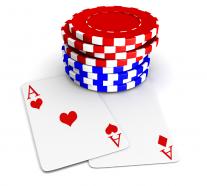 Two heart aces with red and blue poker chips stock photo