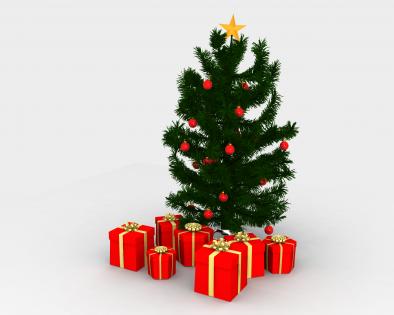 Red gift boxes in front of christmas tree stock photo